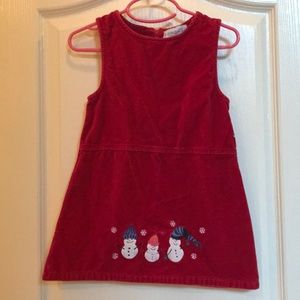 Red jumper with snowman appliqués.